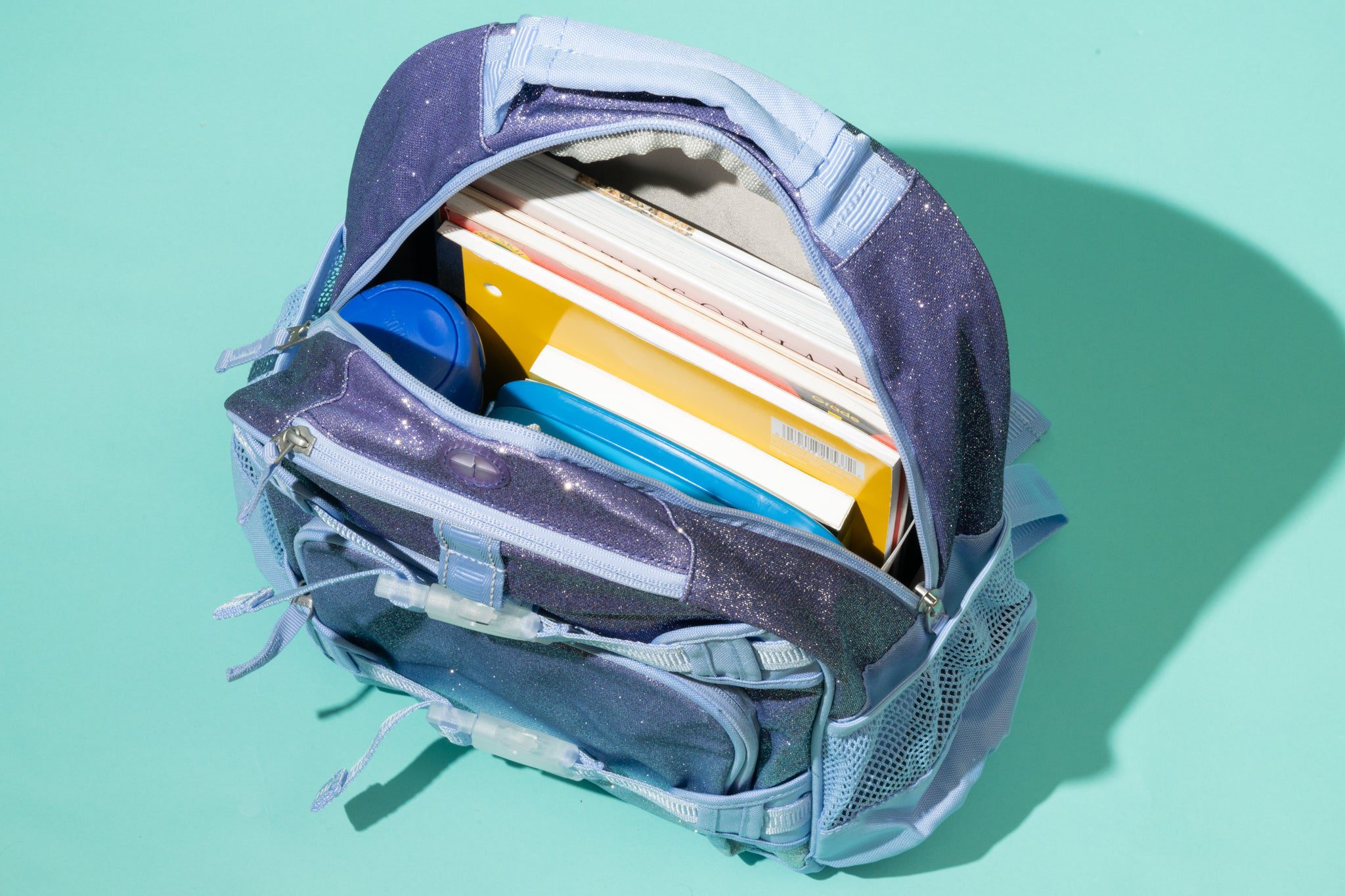 The backpack is loaded with books.